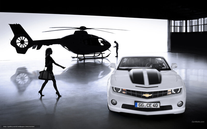 White car and helicopter in hangar