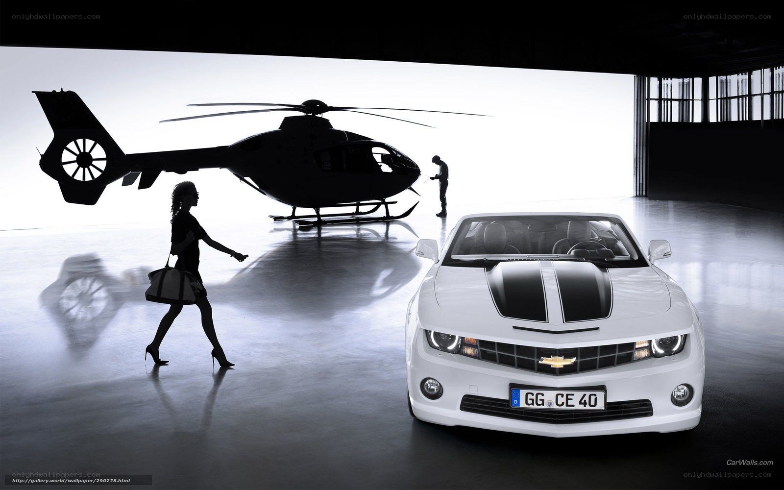 White car and helicopter in hangar