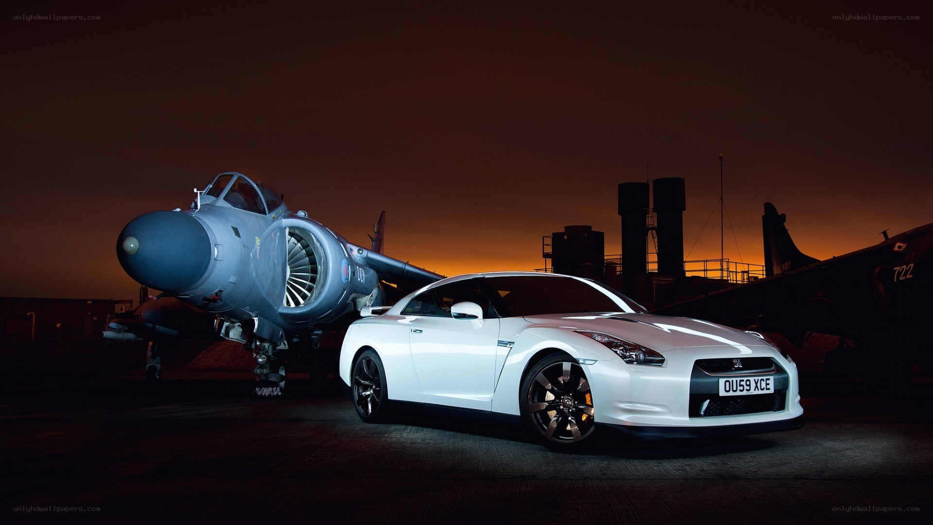 White car and jet at dusk