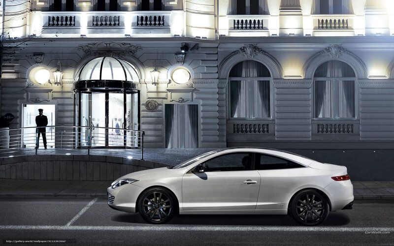 White car at luxury hotel entrance