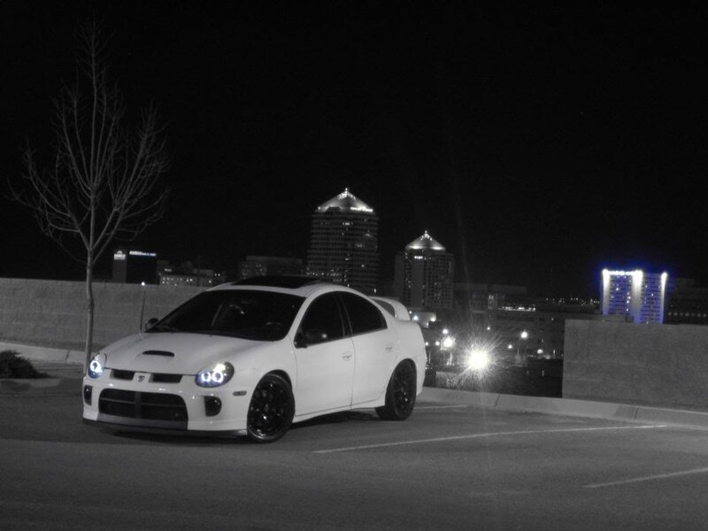 white car at night in city