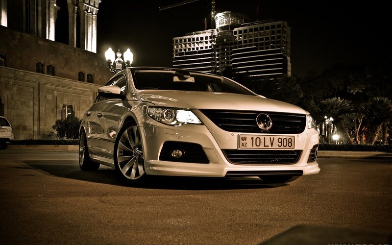 White car at night in city