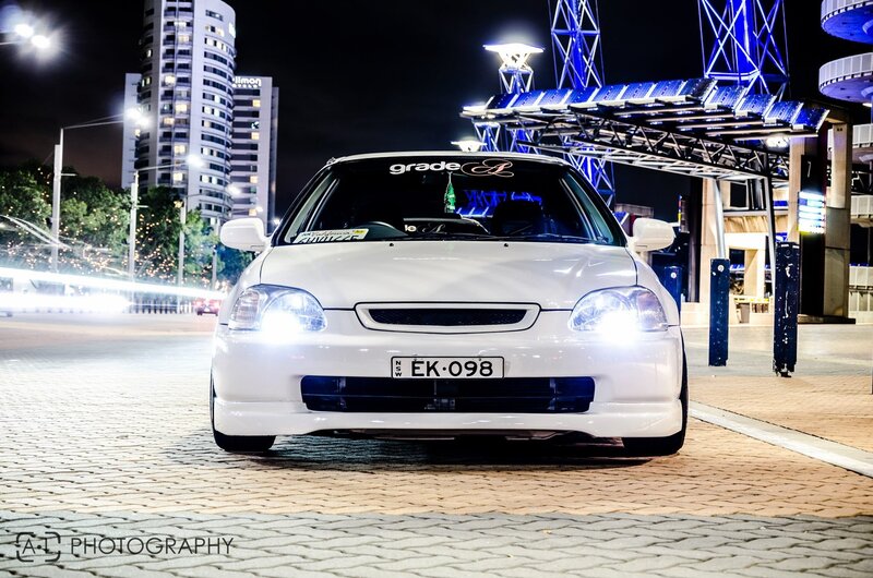 White car at night in city