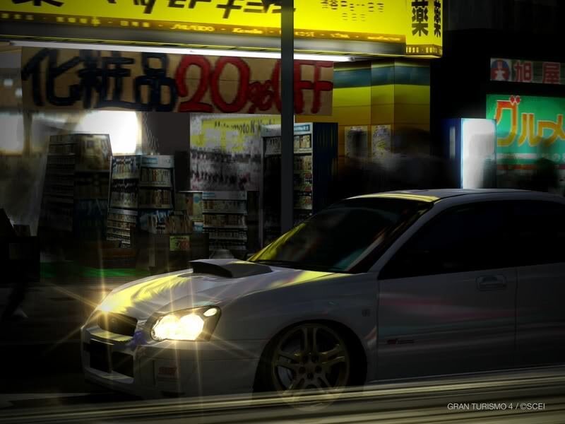 White car at night in city
