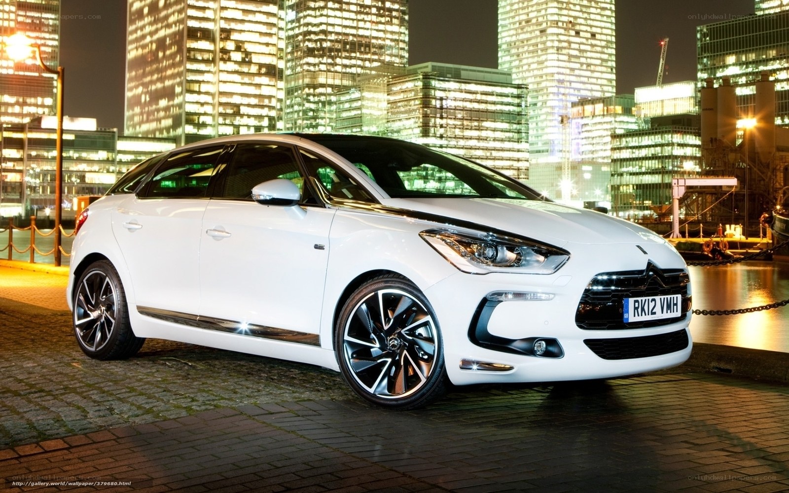 White car at night in city