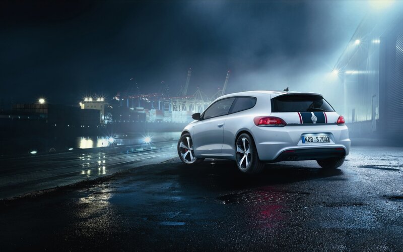 White car at night in port