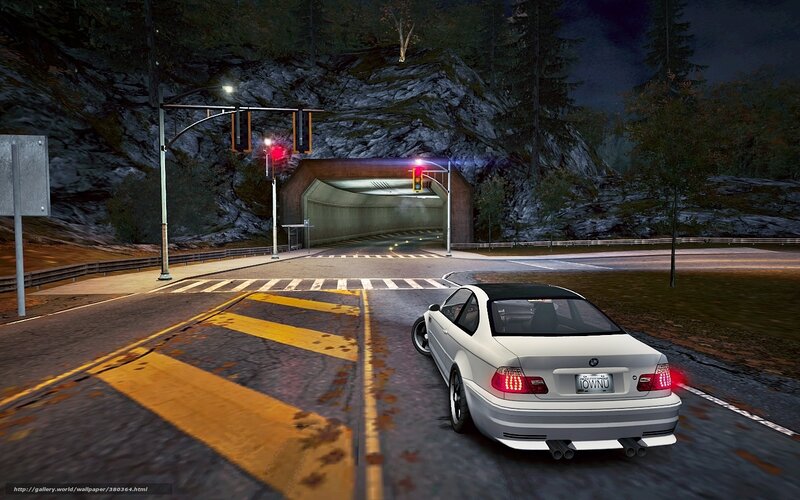 White car at night intersection