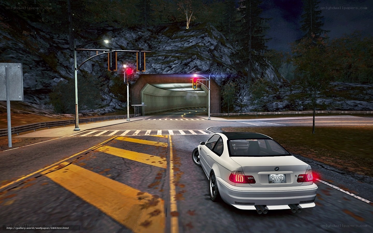 White car at night intersection