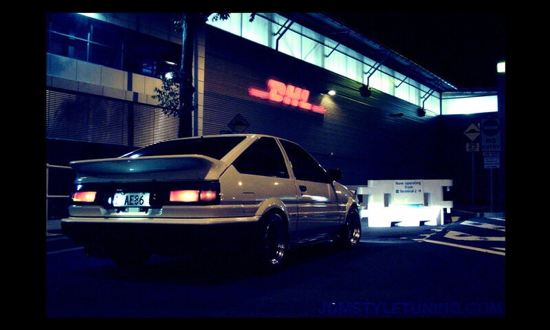 white car at night near DHL