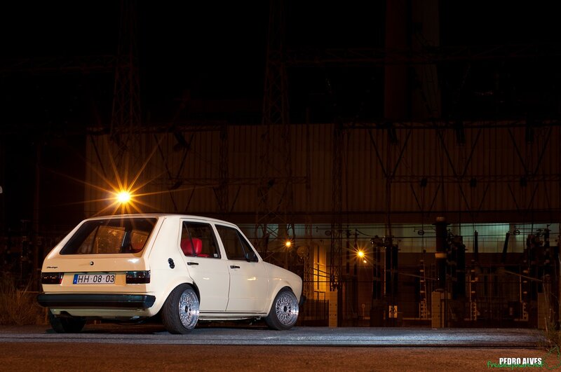 White car at night near power station