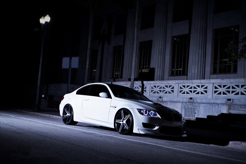 white car at night on street