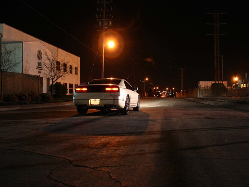 White car at night on street