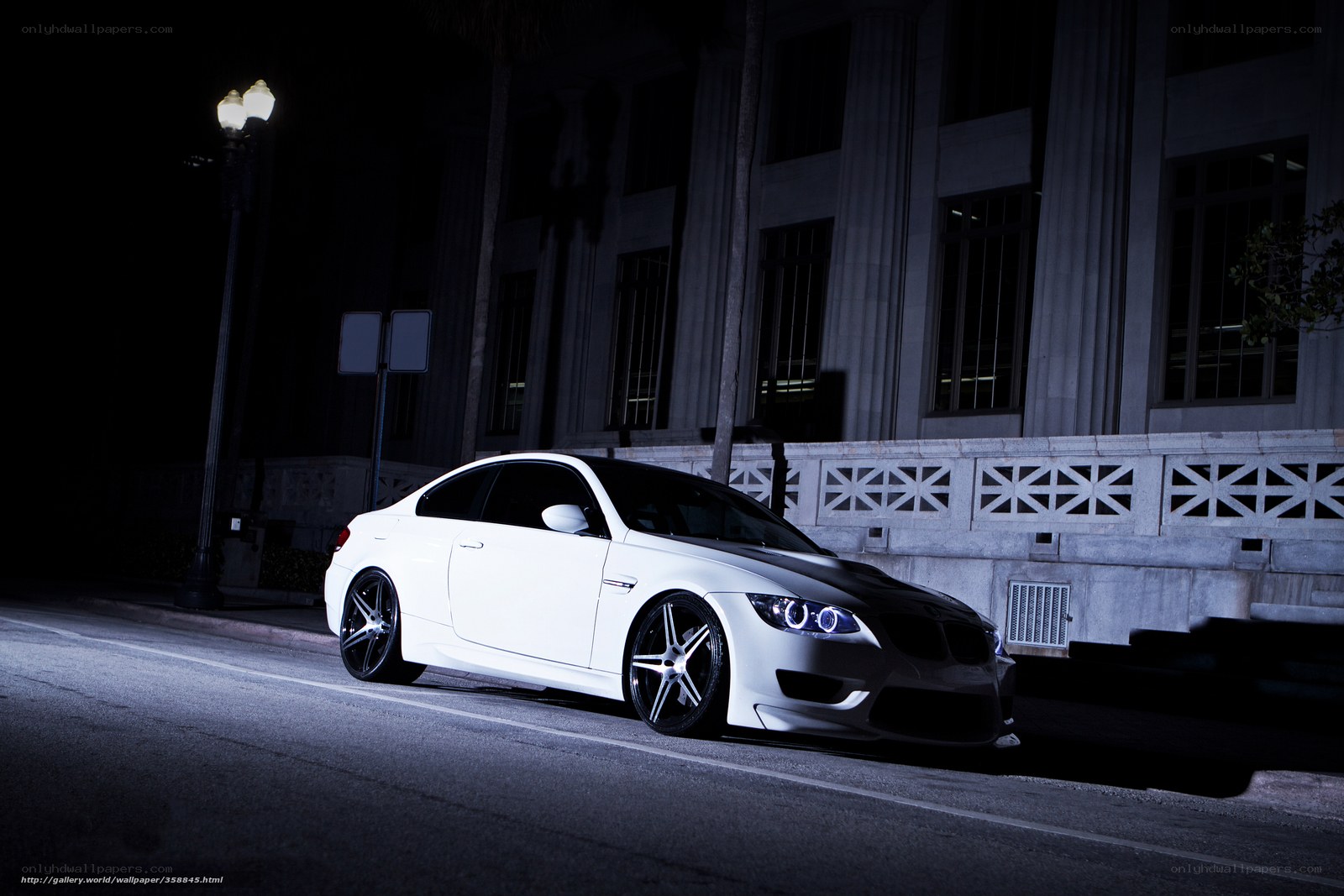 White car at night on street