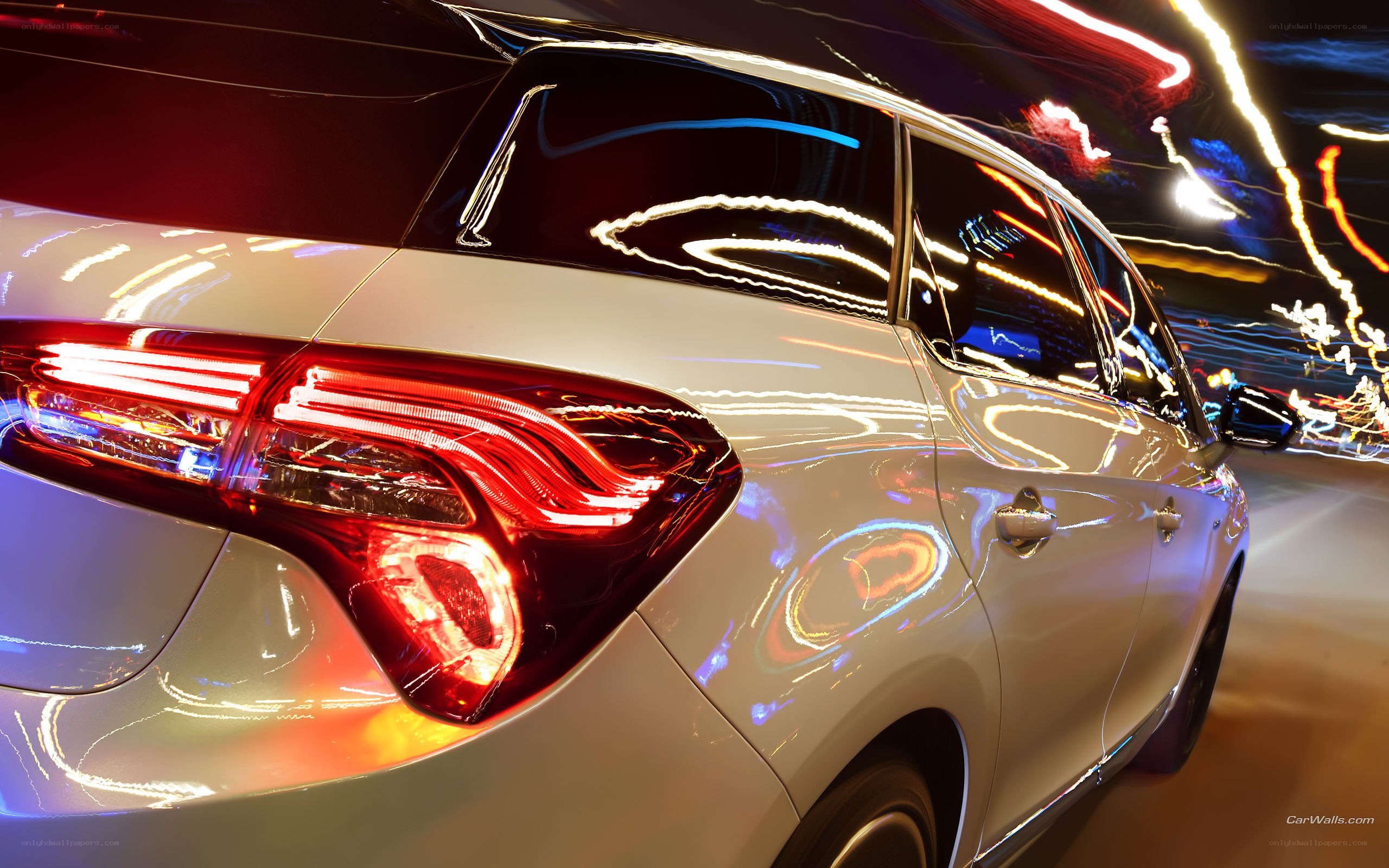 White car at night with light trails