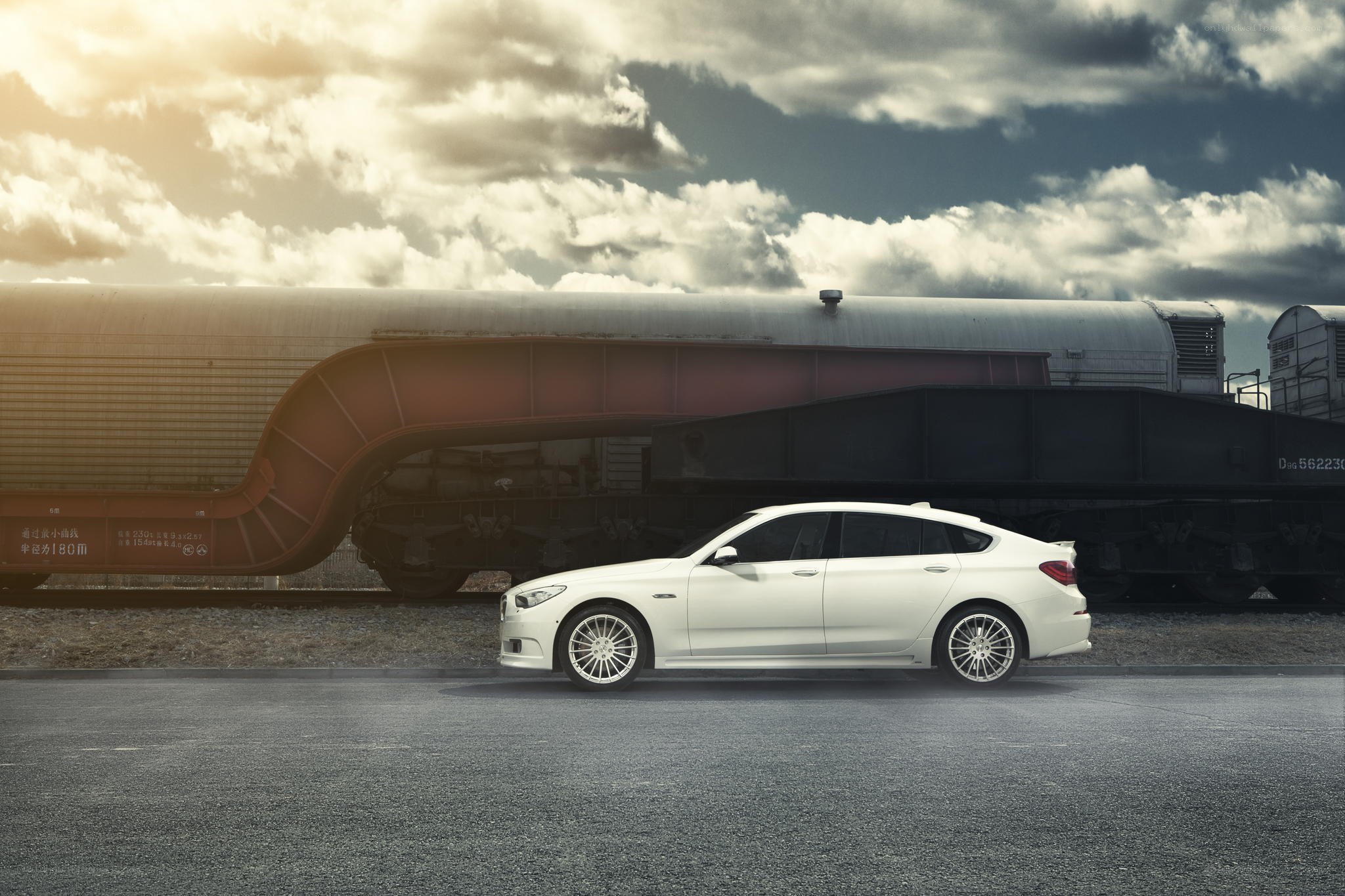 White car beside train