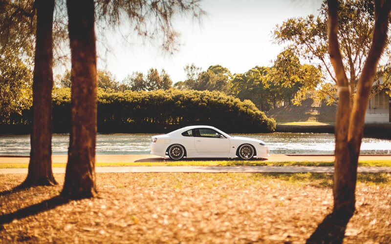 White car by the water