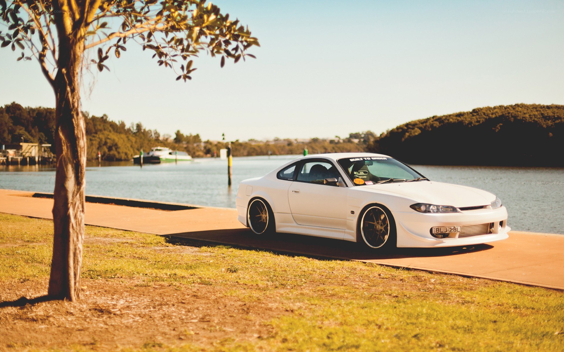 White car by the water
