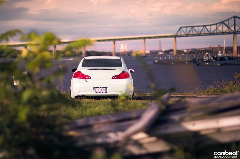 White car by the water at sunset