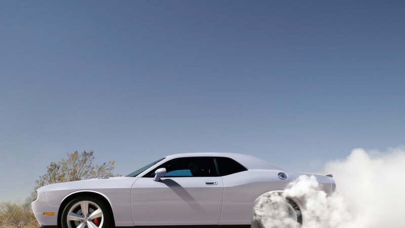 white car doing burnout
