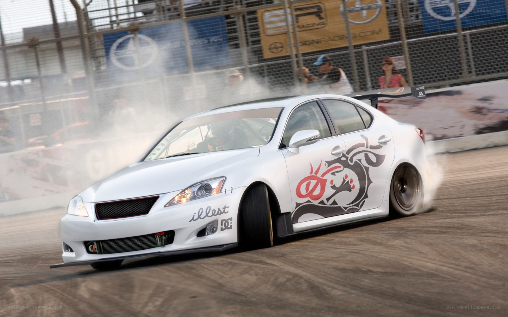 White car drifting at racetrack