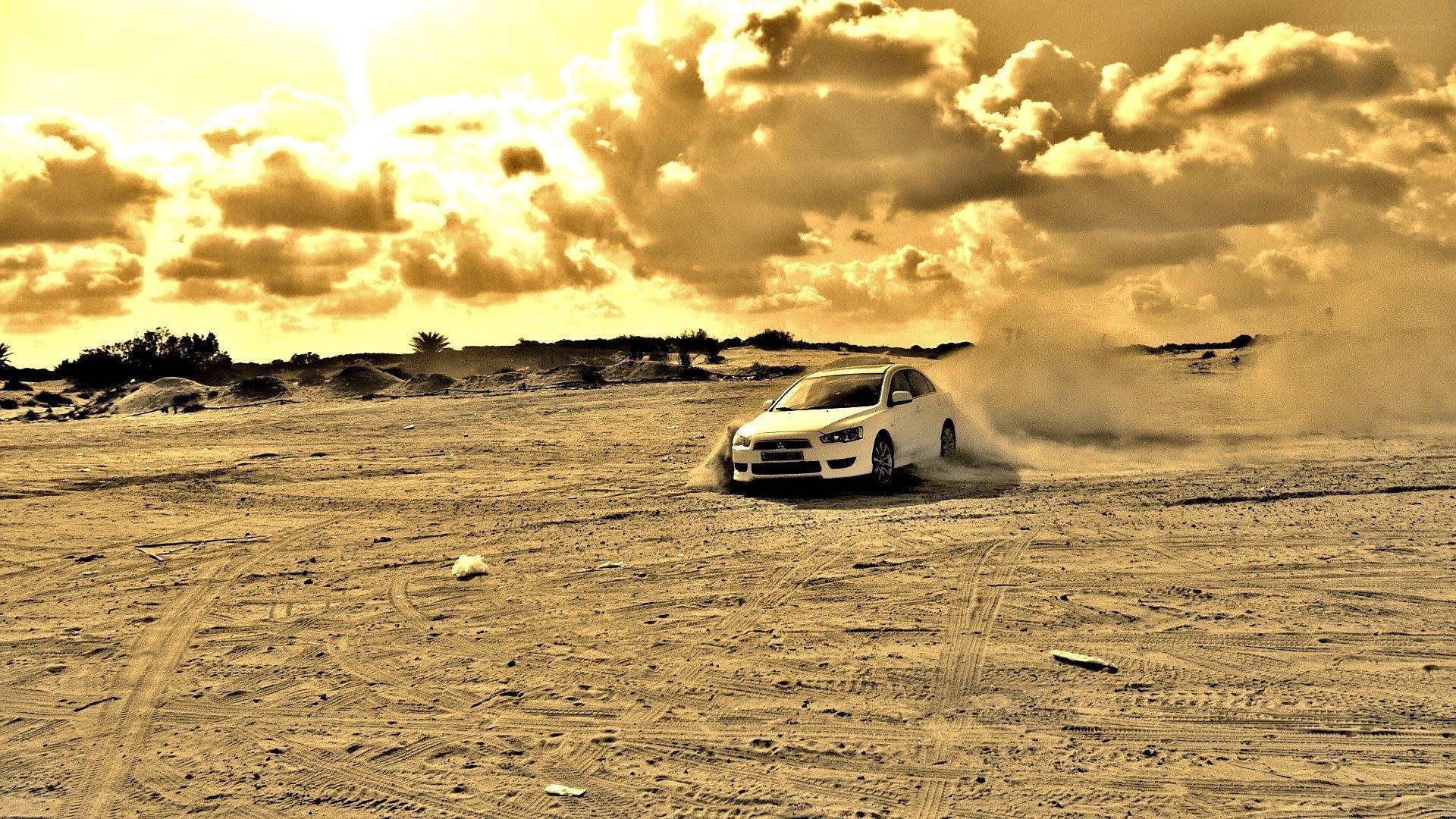 White car drifting in desert