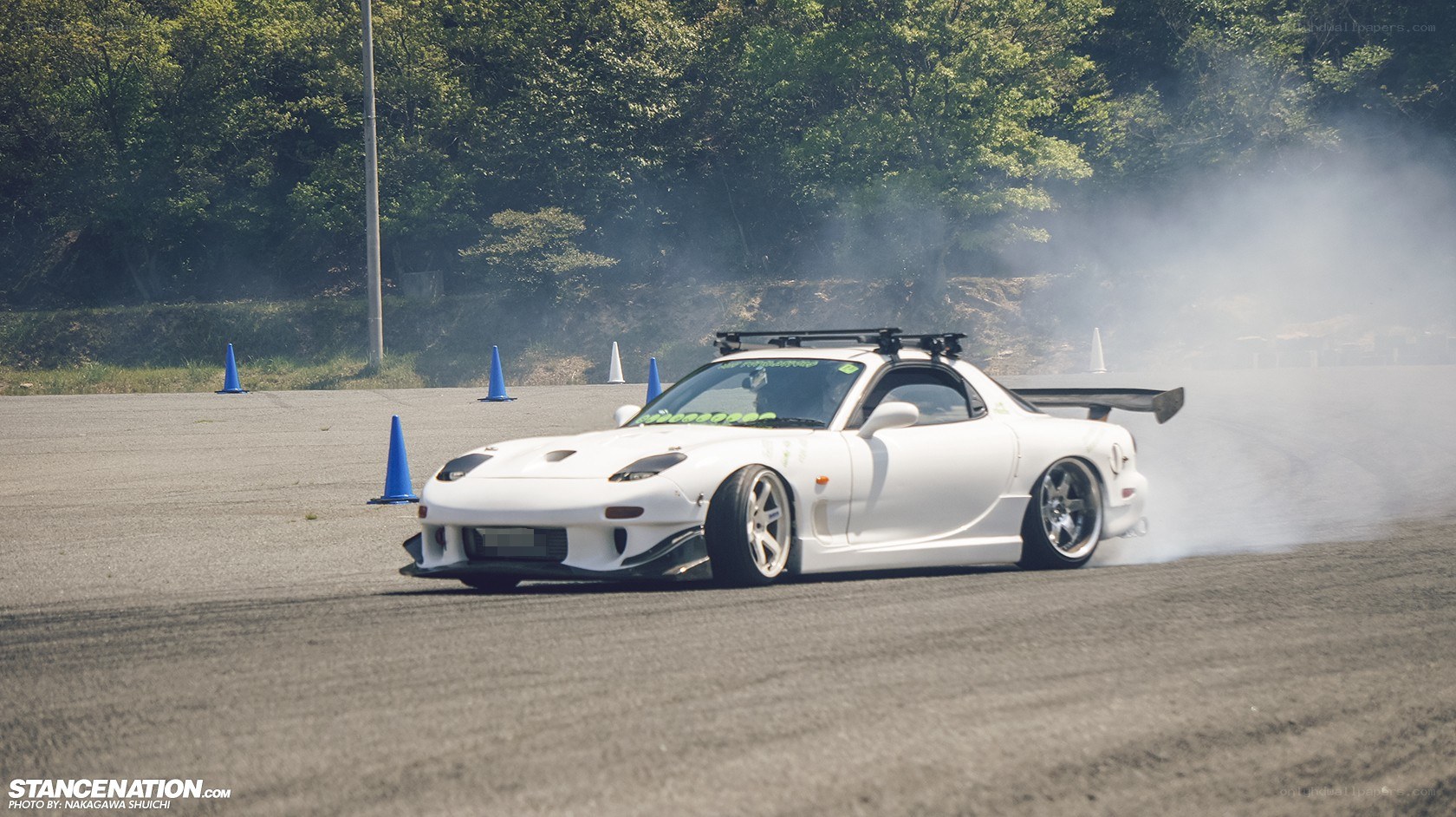 White car drifting on track