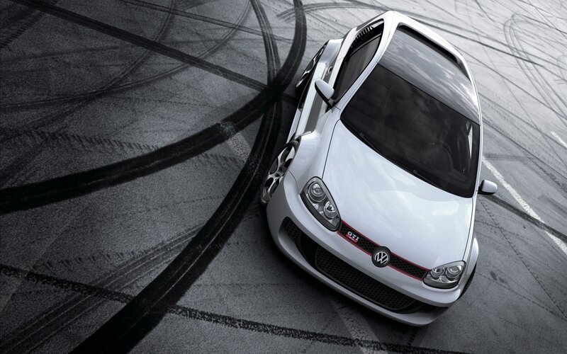 white car drifting on track