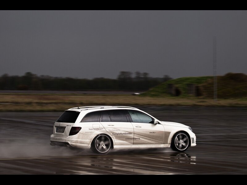white car drifting on wet track