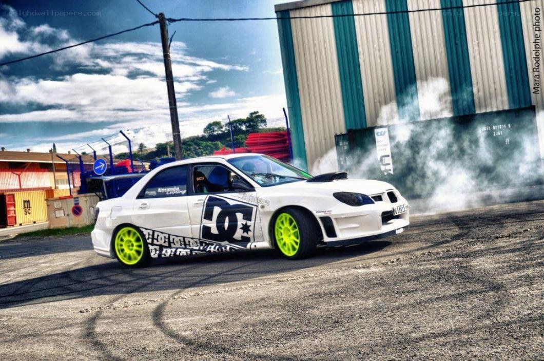 white car drifting with smoke