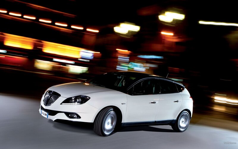 White car driving at night