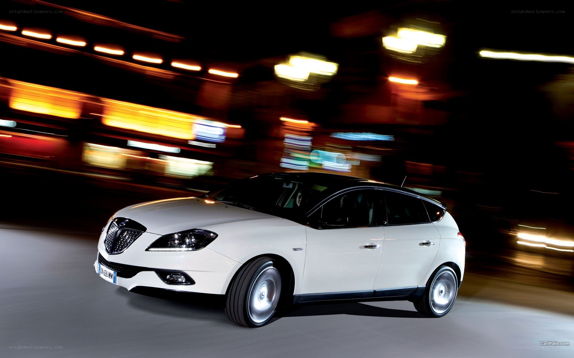 White car driving at night