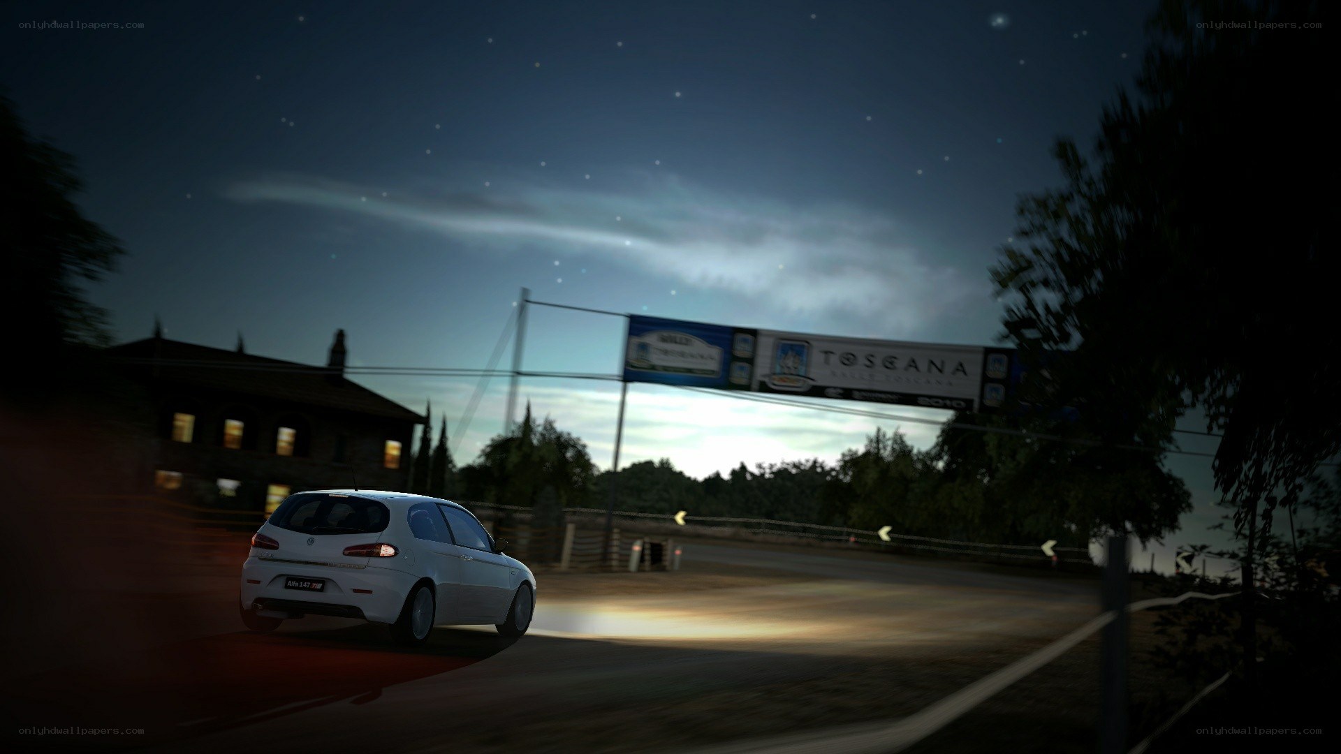White car driving at night