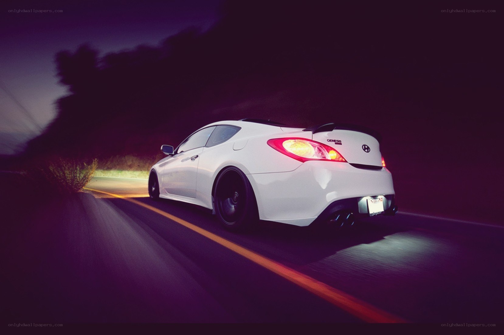 White car driving at night
