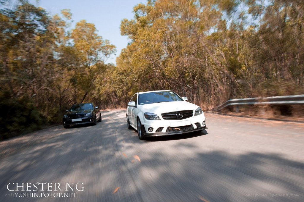 White car driving on a road