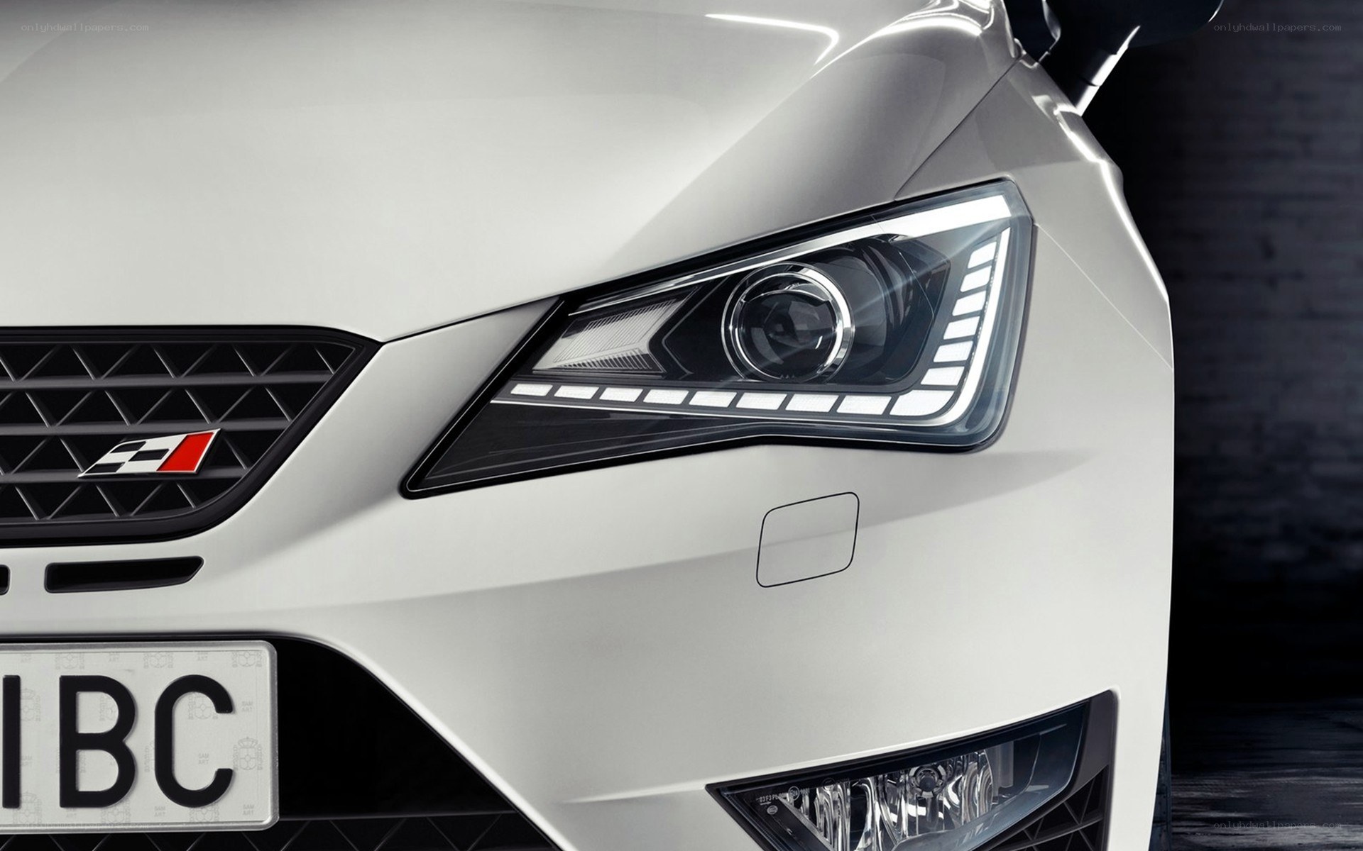 white car front headlight