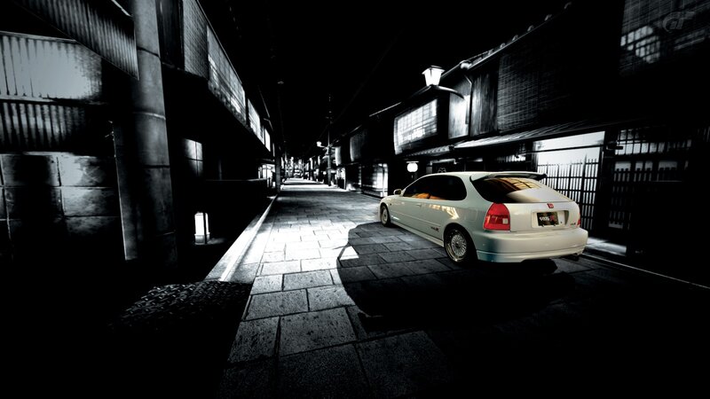 White car in a narrow alley
