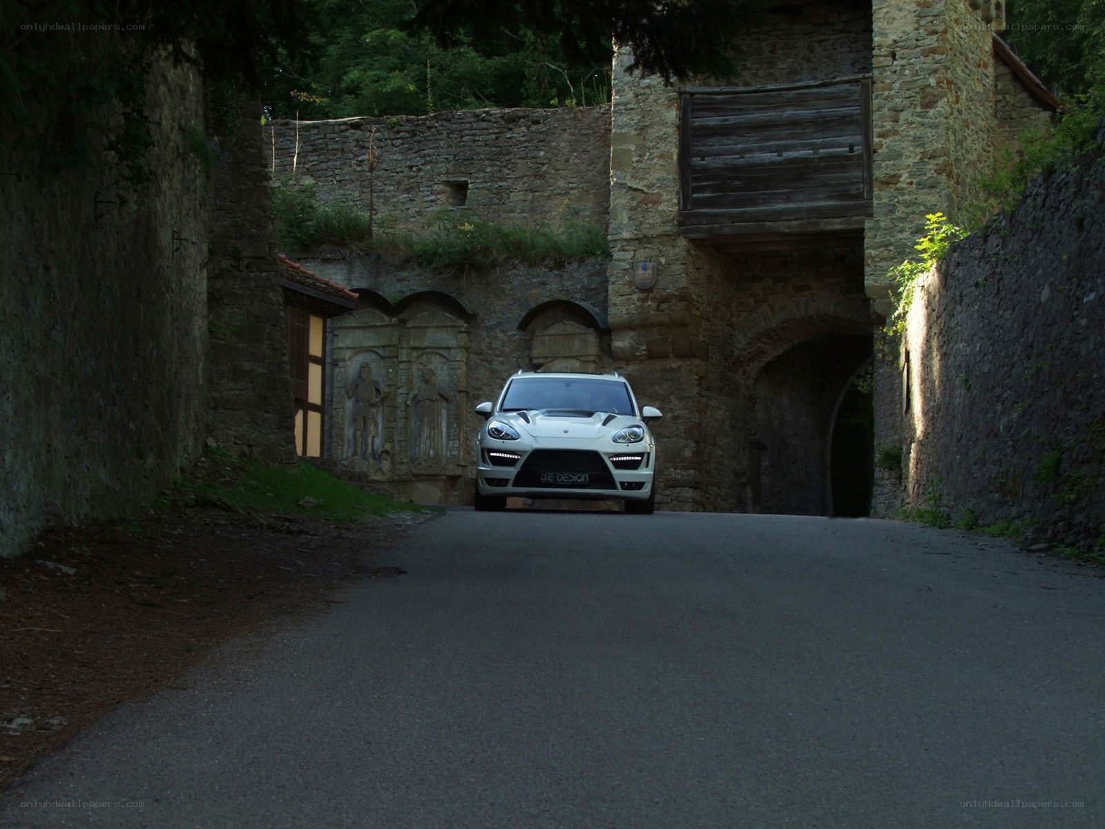 White car in ancient stone tunnel