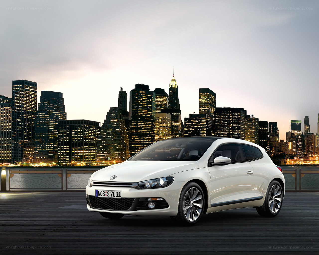 White car in city at dusk