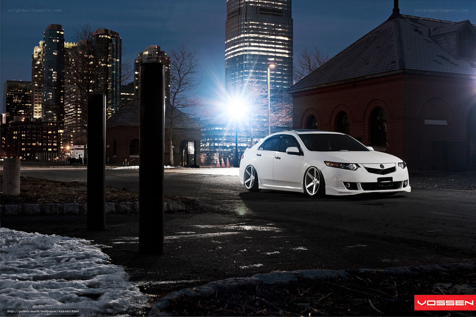 White car in city at night