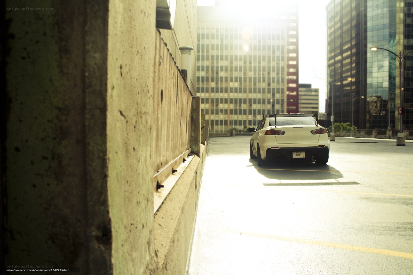 White car in city parking