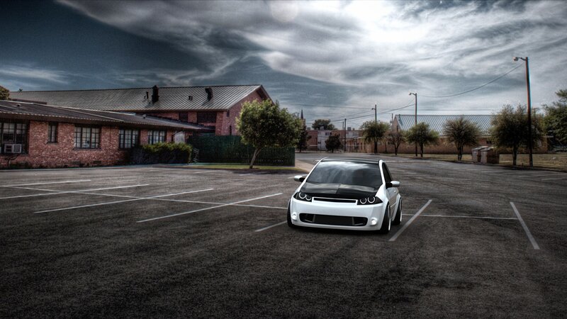 White car in empty parking lot