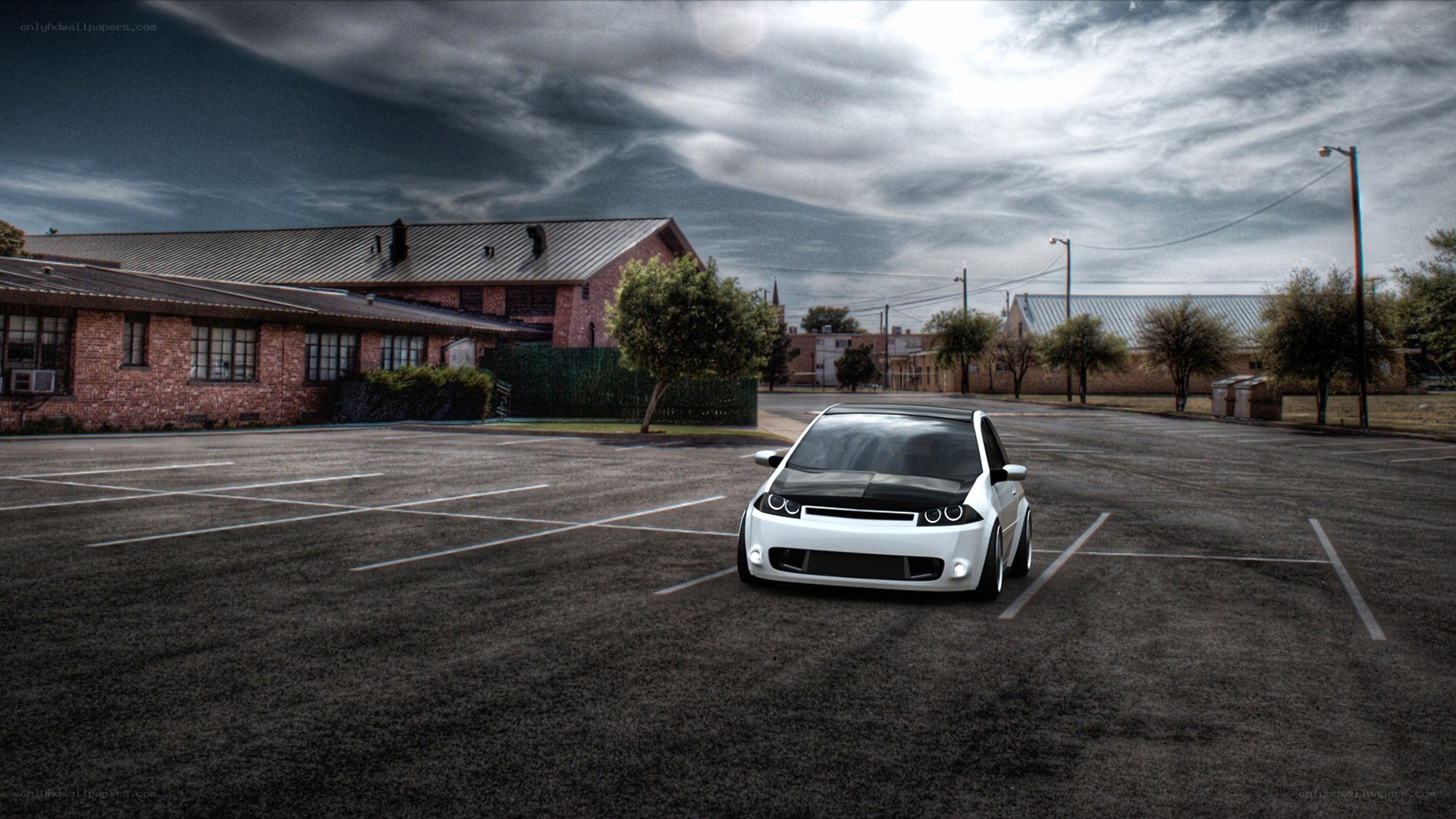 White car in empty parking lot