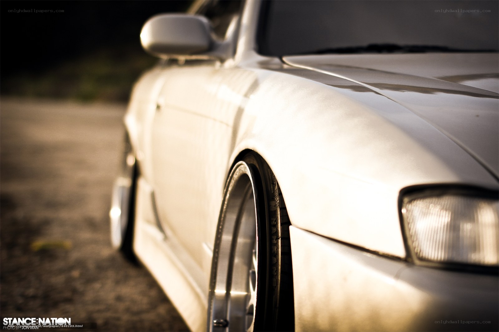 white car in golden light