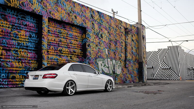 White car in graffiti alley