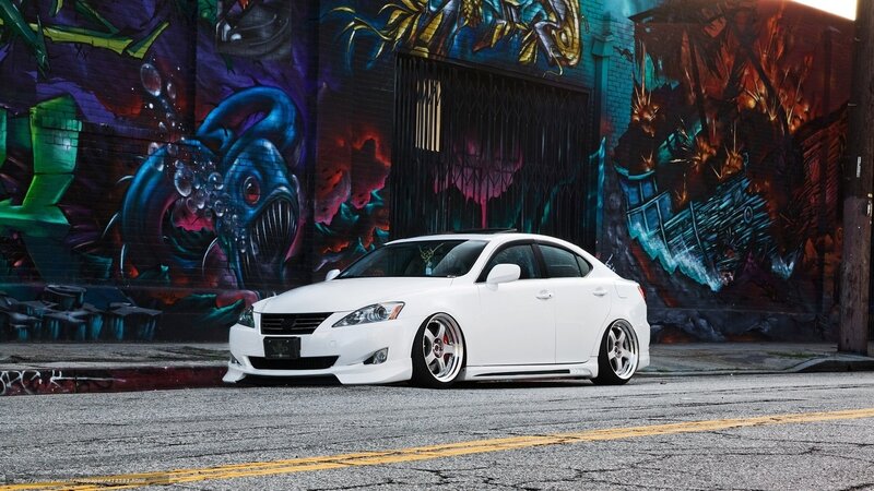 white car in graffiti alley