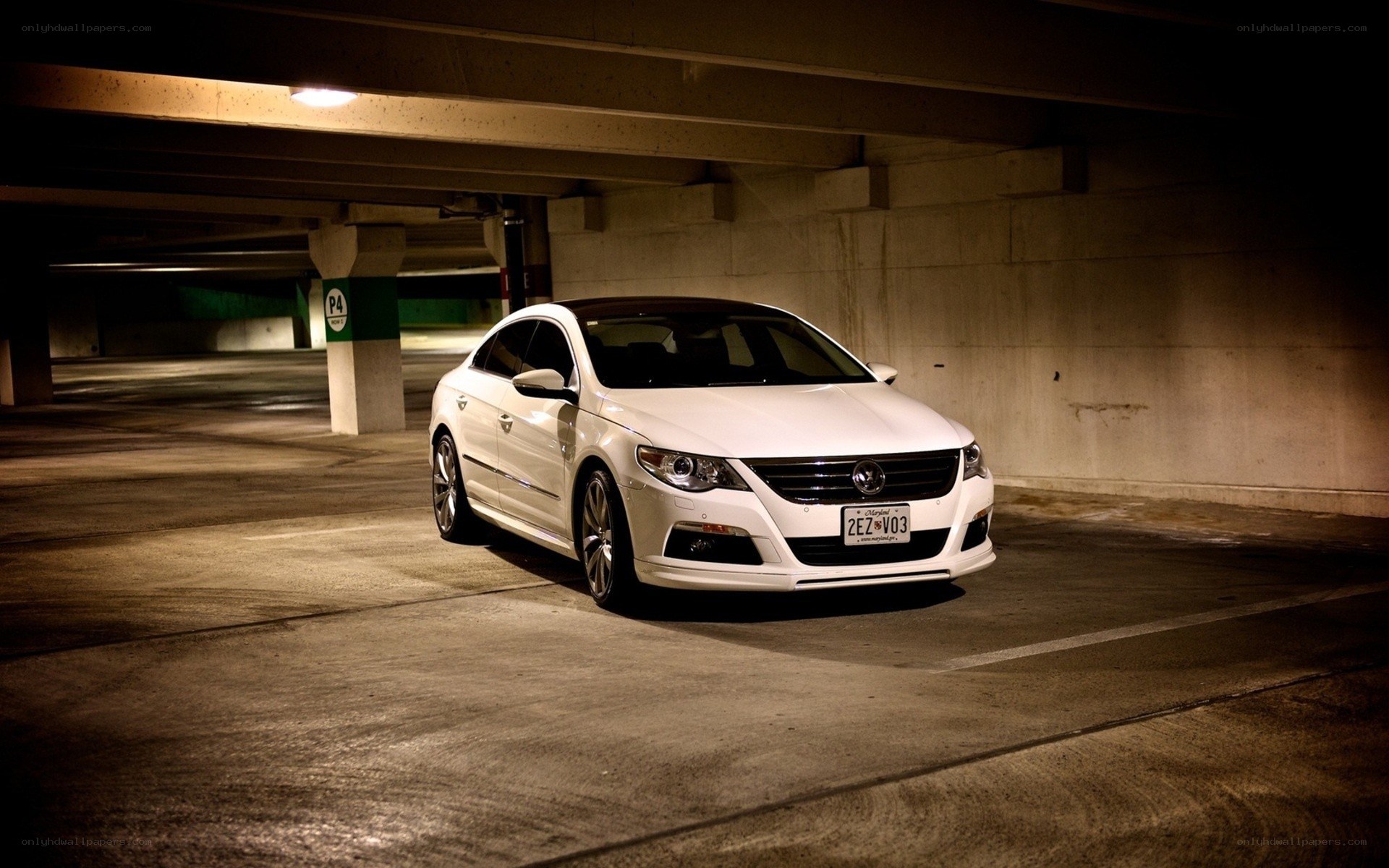 White car in parking garage