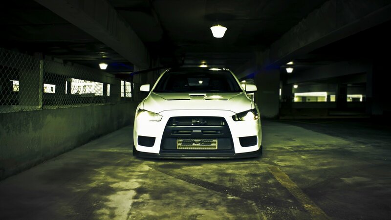white car in parking garage