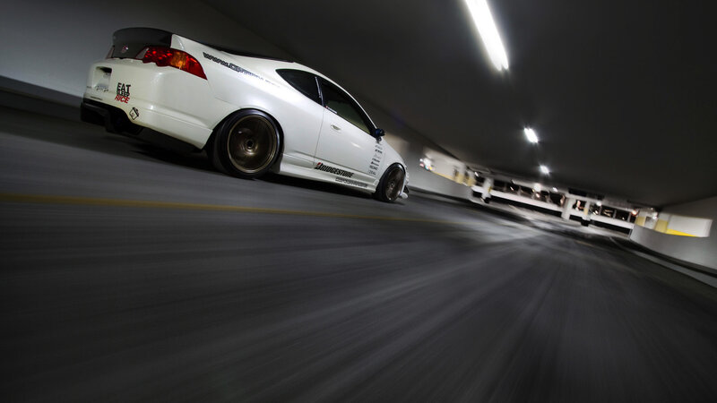 white car in parking garage