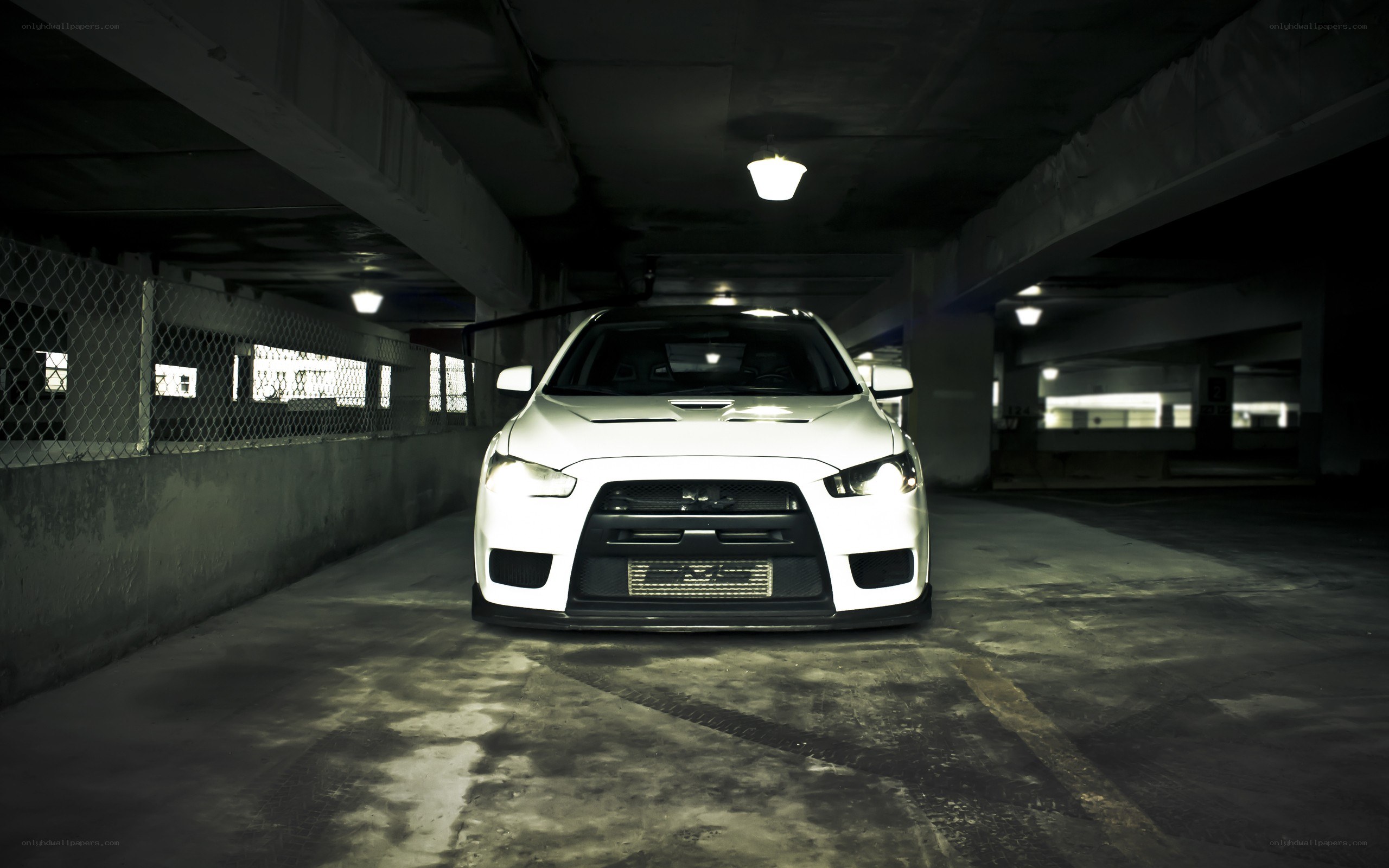 white car in parking garage