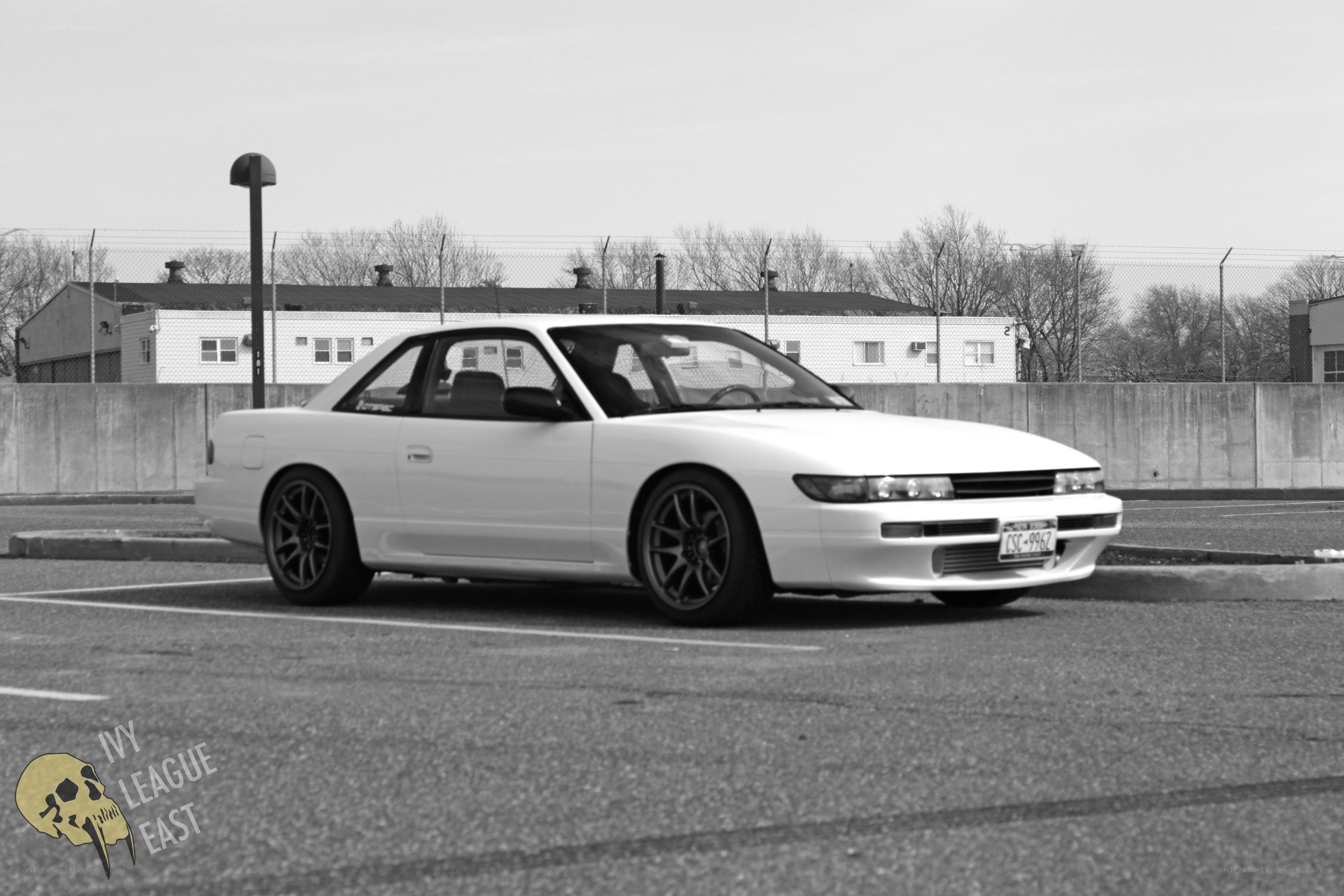 white car in parking lot
